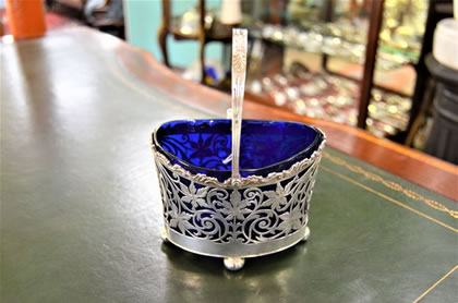 Silver sugar basket with original blue liner.