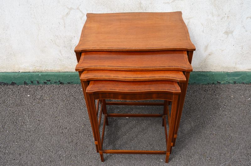 Nest of four mahogany tables