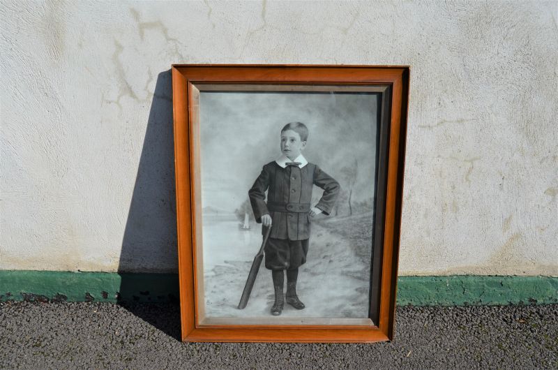 Engraving of boy with cricket bat