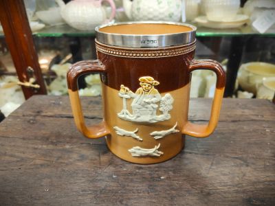 Doulton three handle jug with silver rim