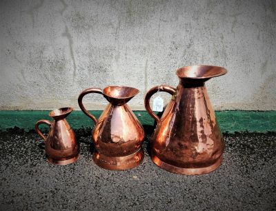 Set of copper jugs