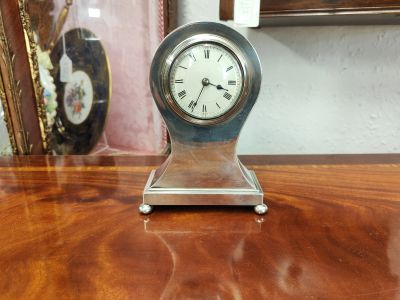 Silver cased clock
