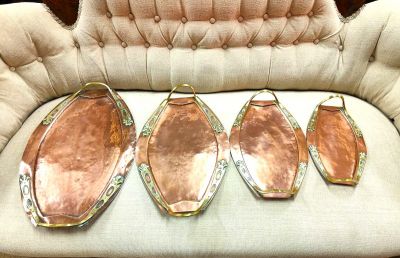 Set of four brass & copper art nouveau trays