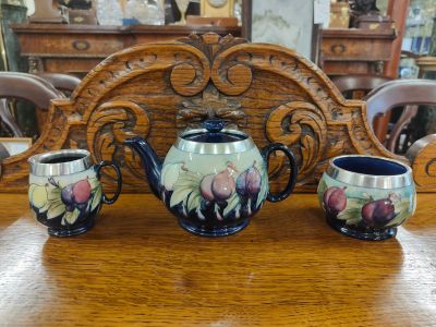 Three piece silver rimmed moorcroft tea set