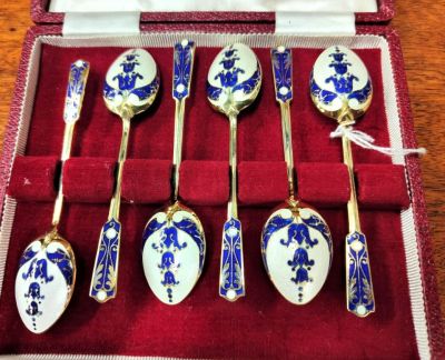 Cased set of silver & enamel spoons