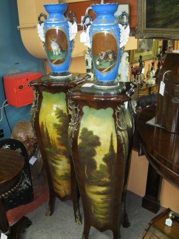 A pair of marble topped pedestals