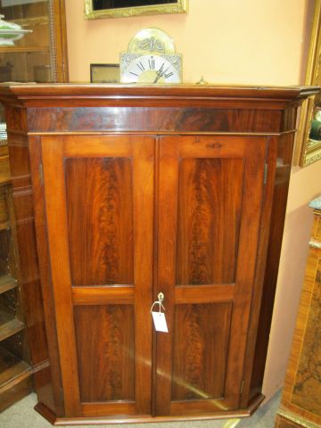 A 19th century corner hanging cabinet
