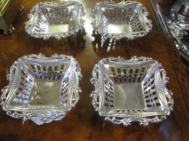 Set of four silver bon bon dishes