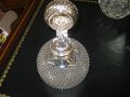 A silver topped perfume bottle Thumbnail 3